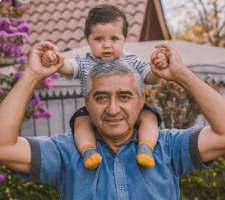 son on father shoulders